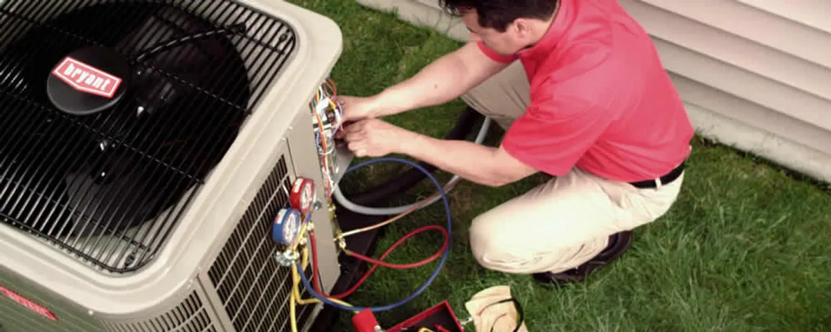 HVAC technician servicing an outdoor air conditioner unit in Orange, CA